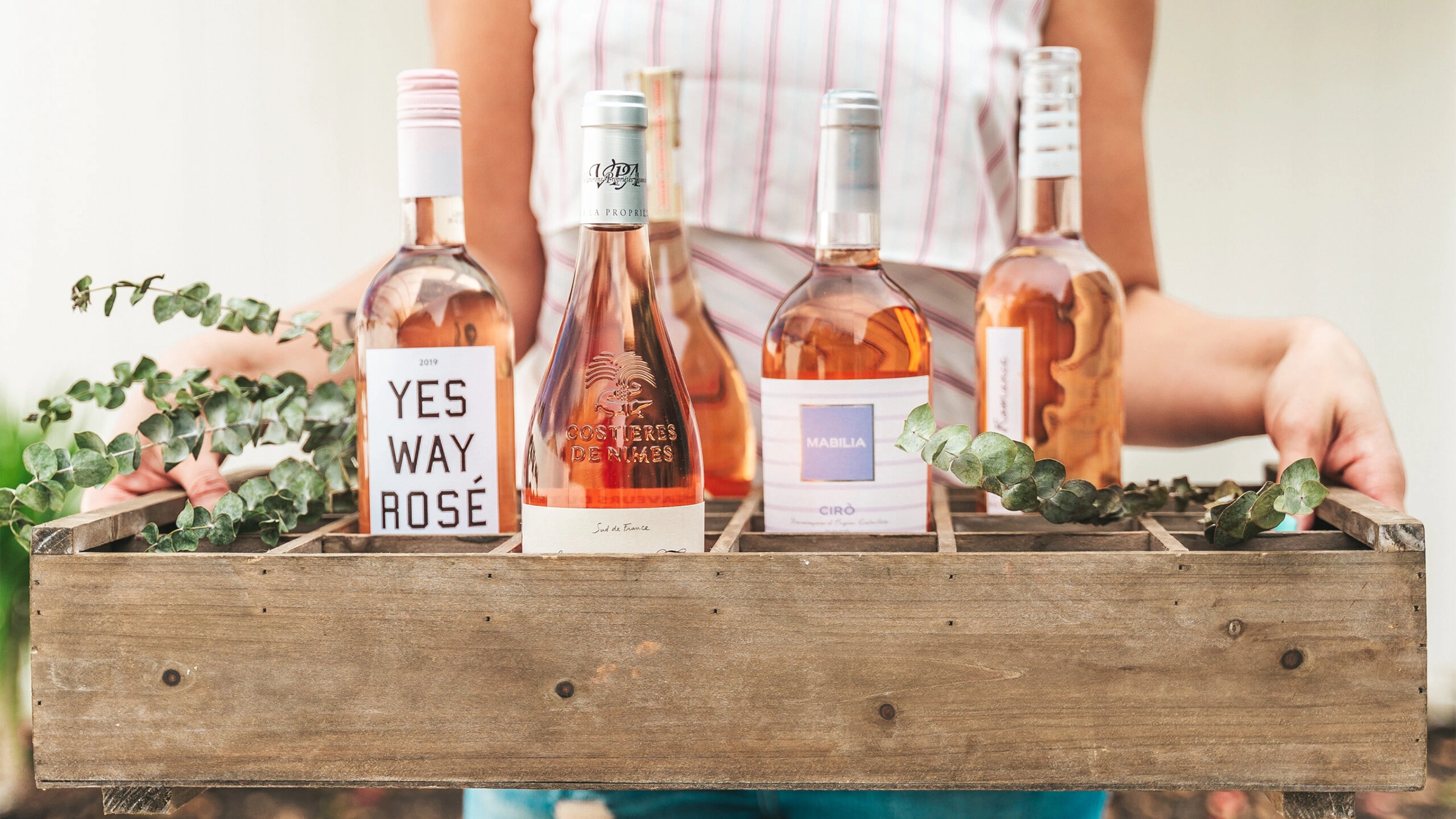 Rosé wine bottles styled for a private bridal wine experience